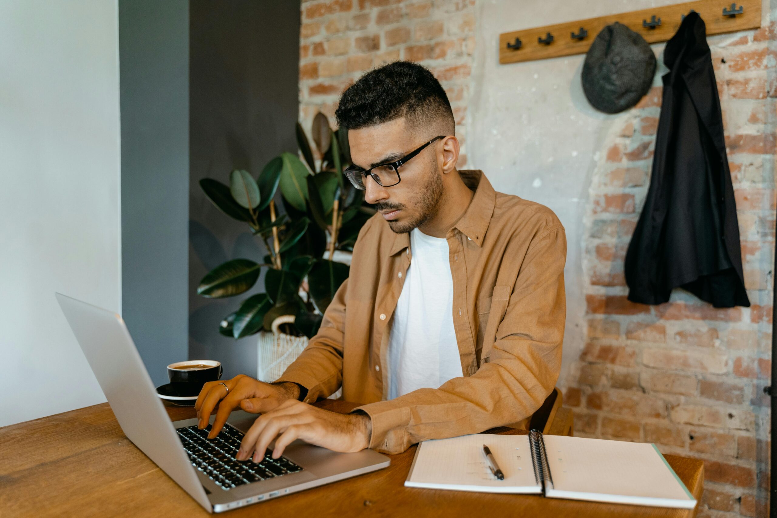 A man searching for entry-level marketing jobs online.